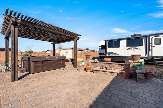 view of patio featuring a hot tub and a pergola