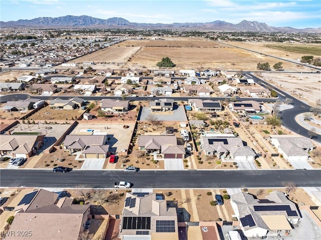 bird's eye view with a residential view and a mountain view