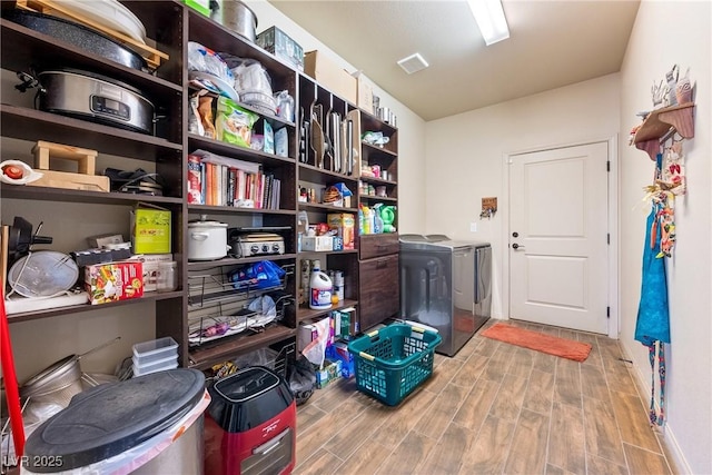 storage room with washer and clothes dryer