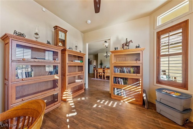 interior space with wood finished floors and a notable chandelier