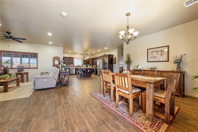 dining area featuring dark wood-style floors, a wealth of natural light, visible vents, and recessed lighting