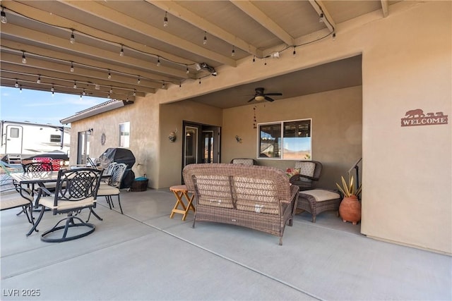 view of patio featuring ceiling fan and outdoor dining space