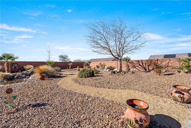 view of yard featuring a fenced backyard