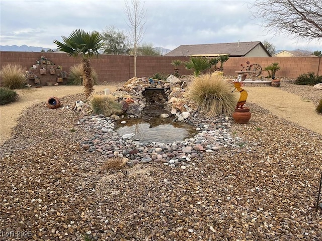 view of yard with a fenced backyard