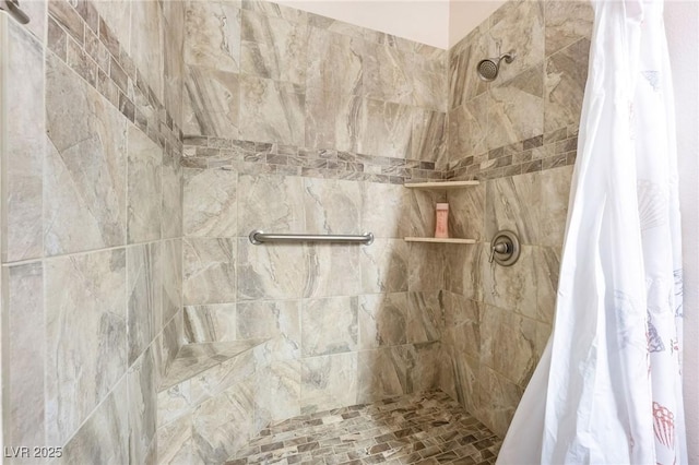 bathroom with tiled shower