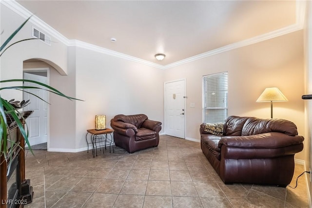 tiled living room with ornamental molding and baseboards