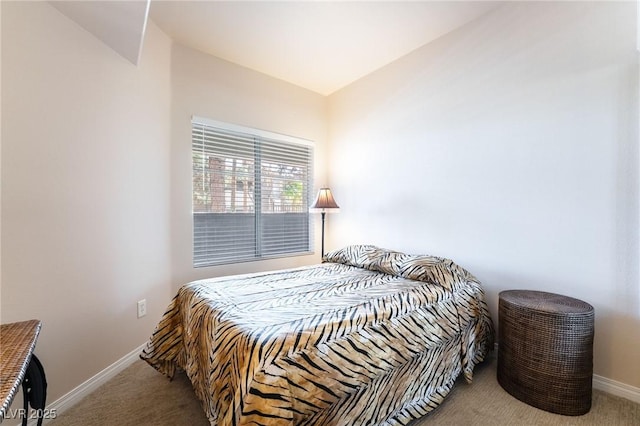 bedroom featuring carpet and baseboards