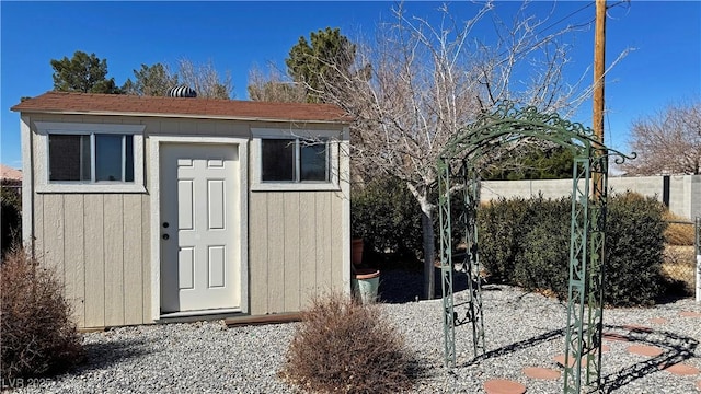 view of shed with fence