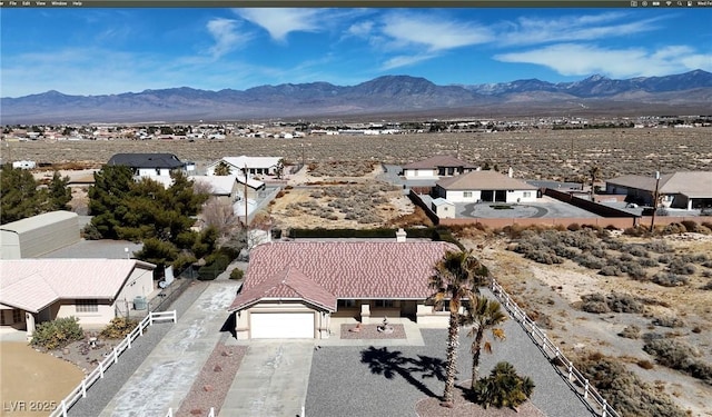 birds eye view of property featuring a residential view and a mountain view