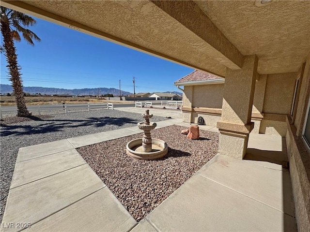 view of patio with a mountain view