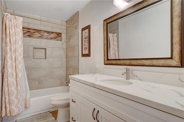 full bathroom with shower / tub combo with curtain, vanity, and toilet