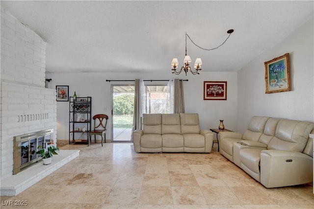 living room featuring a fireplace and a chandelier