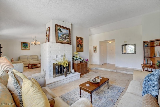 living area featuring a notable chandelier, a fireplace, vaulted ceiling, and a textured ceiling