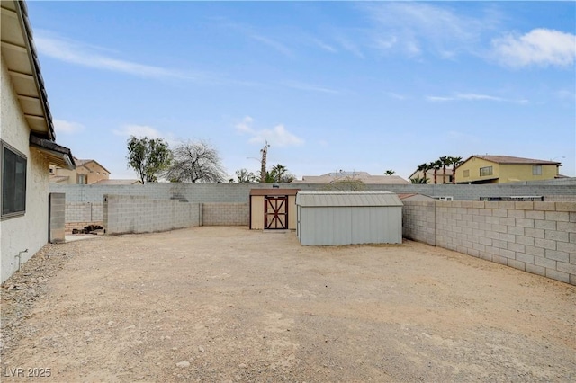 view of yard featuring an outbuilding and a fenced backyard