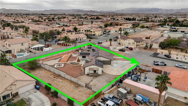 drone / aerial view featuring a residential view and a mountain view