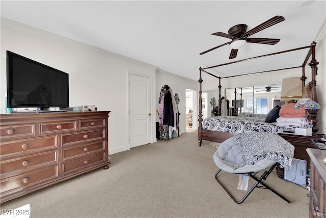 bedroom with a ceiling fan and light carpet