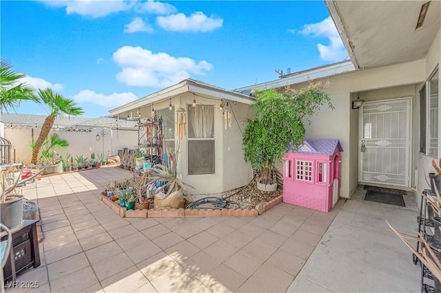 view of patio / terrace featuring fence