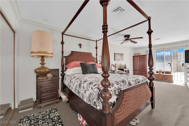 bedroom with carpet floors, visible vents, and ornamental molding