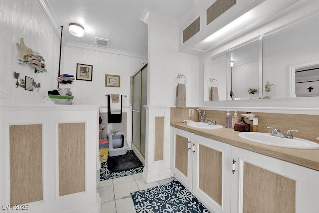 full bathroom with tile patterned floors, visible vents, a sink, and ornamental molding