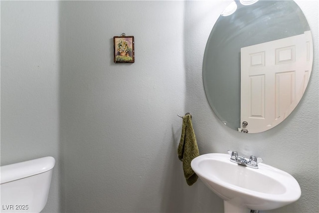 bathroom with a sink and toilet