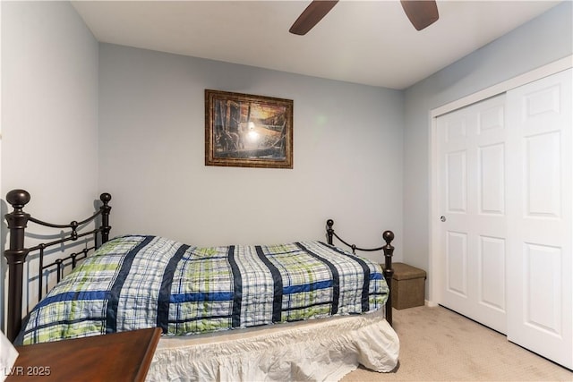 bedroom with a ceiling fan and light colored carpet