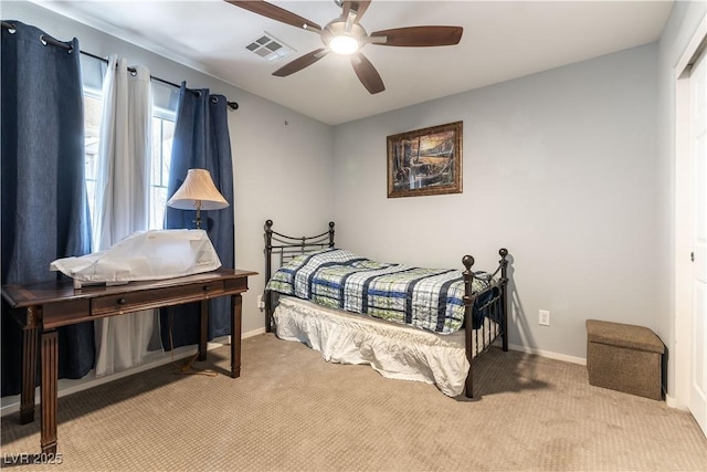 bedroom featuring carpet, visible vents, and baseboards