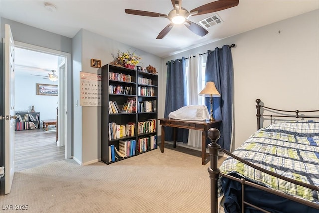 bedroom featuring a ceiling fan, carpet flooring, visible vents, and baseboards