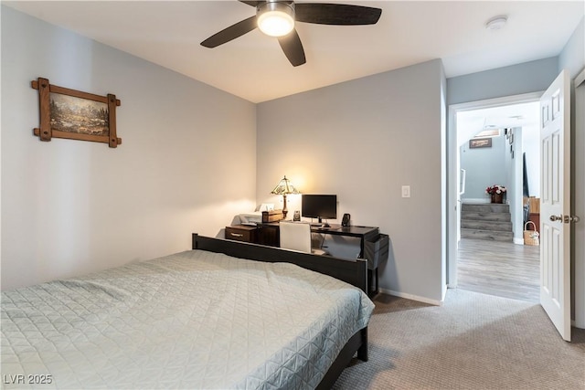 bedroom featuring a ceiling fan, carpet, and baseboards