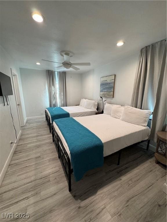 bedroom with baseboards, recessed lighting, a ceiling fan, and light wood-style floors