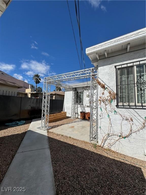 view of patio with fence