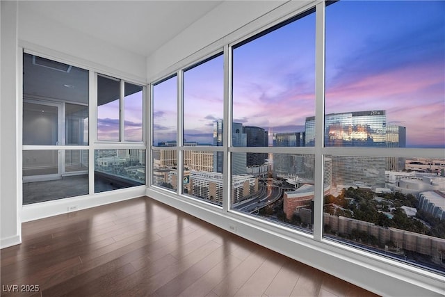 unfurnished sunroom featuring a city view