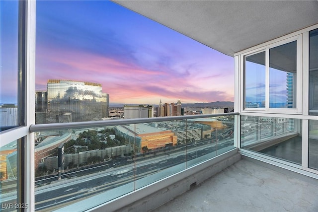 balcony at dusk with a city view