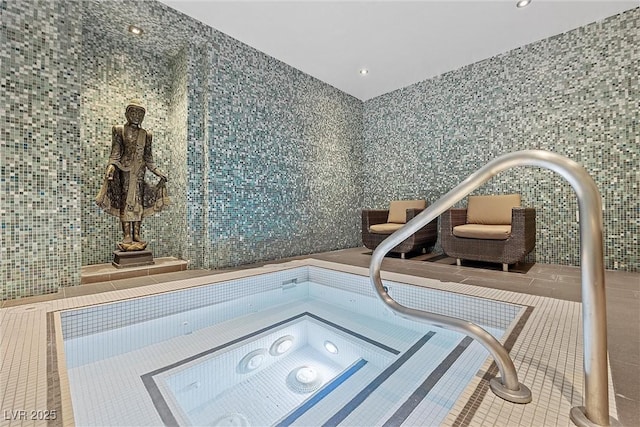 view of pool with an indoor in ground hot tub