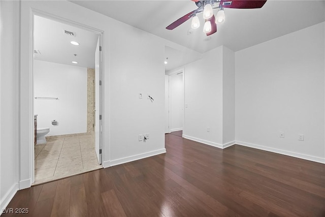 empty room featuring ceiling fan, recessed lighting, wood finished floors, visible vents, and baseboards