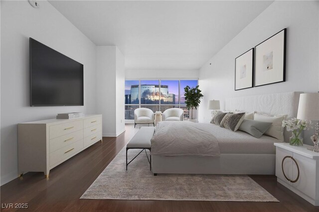 bedroom with dark wood-style floors