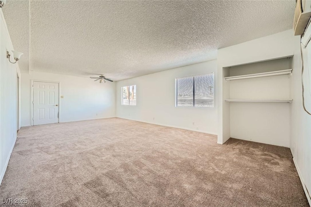 unfurnished bedroom with carpet flooring and a textured ceiling