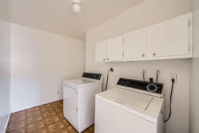 washroom with cabinet space, baseboards, light floors, and washing machine and clothes dryer