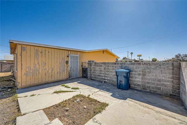 exterior space featuring a patio area and fence