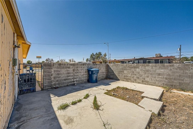 view of yard featuring a patio area and a fenced backyard