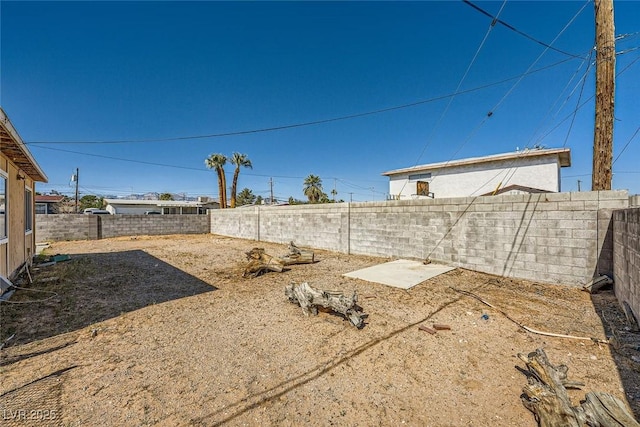 view of yard with a fenced backyard