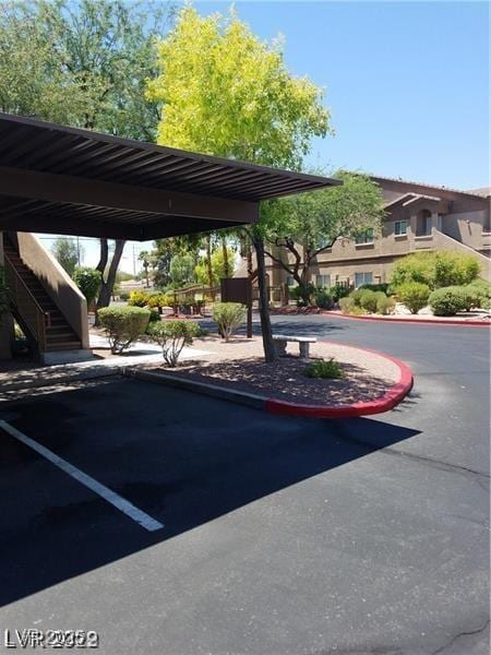 view of vehicle parking featuring stairs