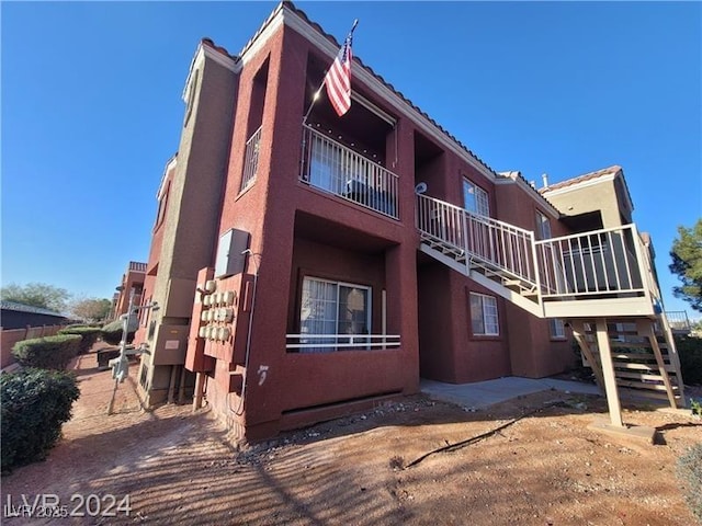 view of property with stairway