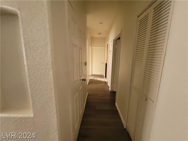 hall with dark wood finished floors