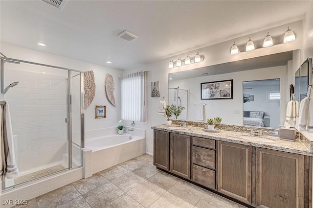 bathroom with visible vents, ensuite bath, a sink, a shower stall, and a bath