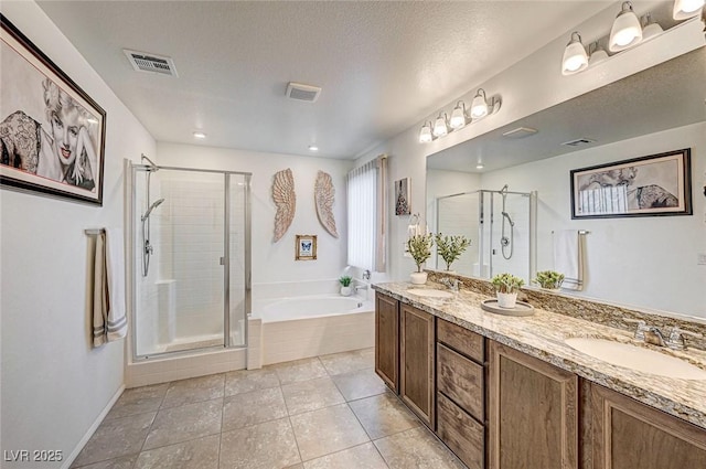 full bathroom featuring a bath, a sink, visible vents, and a shower stall