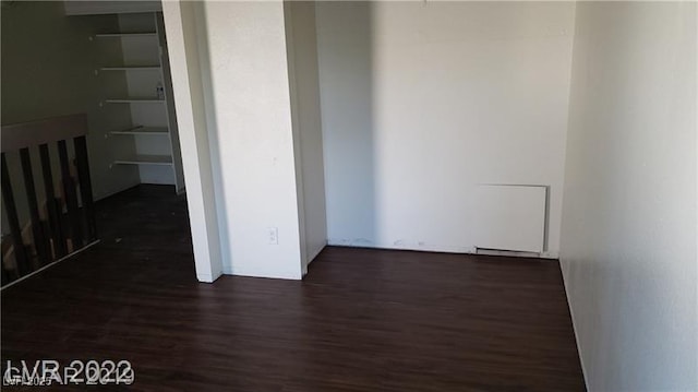 unfurnished room with wood finished floors