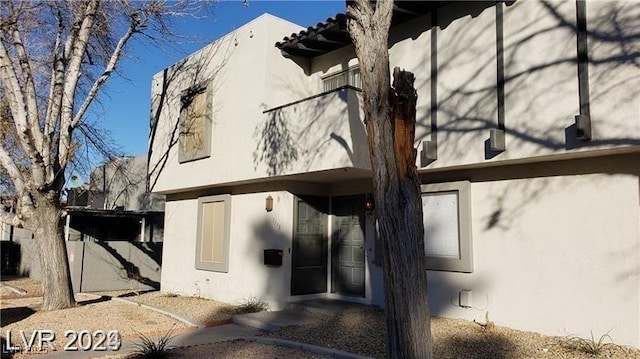 exterior space with stucco siding