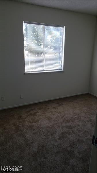 spare room with carpet floors and baseboards