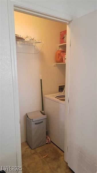 clothes washing area with laundry area and washer / dryer