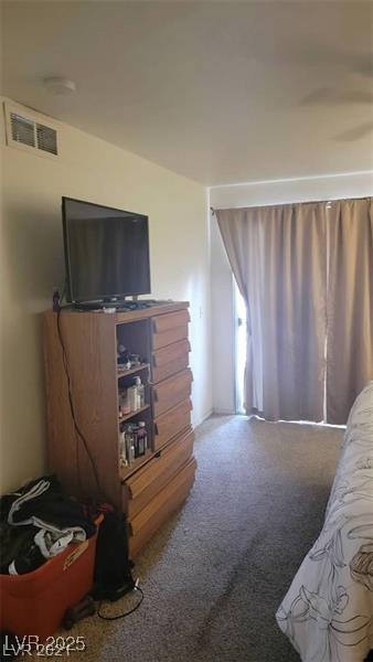 carpeted bedroom with visible vents